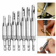 Set of 7 silver metal pocket hole drill bit guide bits for woodworking projects.