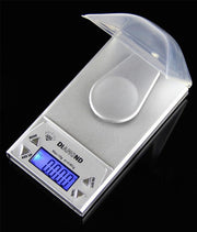 Digital precision diamond scale with LCD display and protective cover.