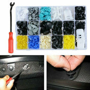 Assorted automotive trim clips and fasteners in a storage organizer with a removal tool.