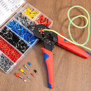 Crimping tool with a sorted kit of colorful electrical wire ferrules on a wooden surface