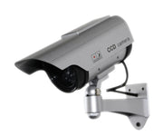Silver CCD security camera mounted on a wall bracket for surveillance.