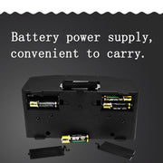 Black electronic device with AA battery compartment and portable battery power supply.
