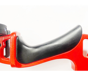 Close-up of a red metal tool handle with a black ergonomic rubber grip