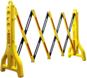 Expandable yellow retractable barrier with red and white reflective safety stripes.