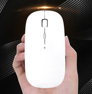 Person holding a white wired optical computer mouse against a dark background.