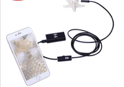 Portable wireless WiFi endoscope camera connected to a smartphone for inspection.