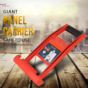 Red giant panel carrier tool for lifting and transporting heavy sheets on a wooden floor