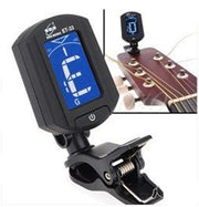 Digital clip-on guitar tuner showing E string note on blue backlit display.