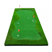 Portable artificial grass golf putting green mat with three holes and red flags.