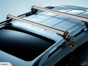 Silver aluminum roof rack cross bars installed on a blue vehicle roof