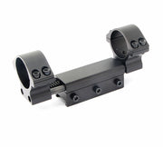 Black adjustable scope mount ring for rifle optics on a white background