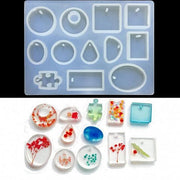 Silicone mold for DIY resin jewelry making with colorful floral embedded pendants.