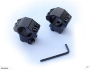 Two black tactical scope rings with an Allen wrench on a white background