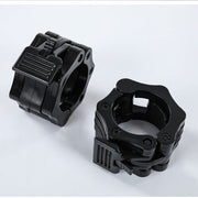 Pair of black adjustable heavy-duty weightlifting wrist cuffs on a white background.
