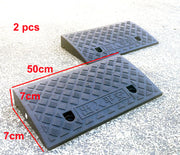 Pair of black rubber threshold ramps, 50cm long and 7cm high for easy access.